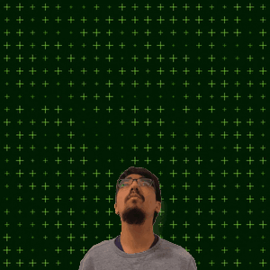 A Man With Glasses Stands In Front Of A Green Background That Says 1 + 15 On It GIF