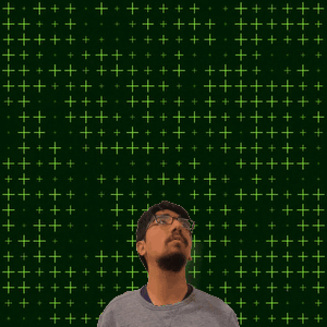 A Man With Glasses Stands In Front Of A Green Background With The Number 19 GIF