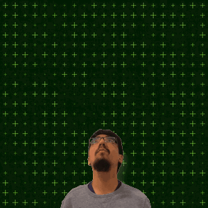 A Man With Glasses Stands In Front Of A Green Background With The Number 9 And 15 On It GIF