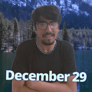 A Man With Glasses Stands In Front Of A Lake With The Date December 29 On The Bottom GIF