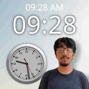 a man with glasses stands in front of a wall clock that says 09:28 am