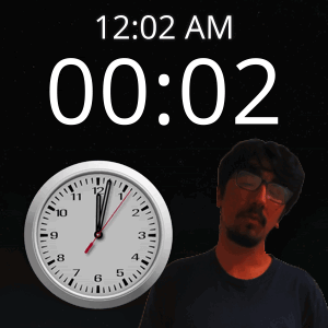 A Man With Glasses Stands Next To A Clock That Says 12:02 Am GIF