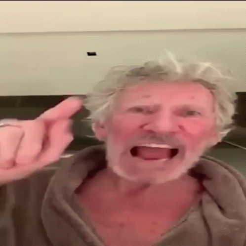 A Man With Gray Hair And A Beard Is Giving A Middle Finger GIF