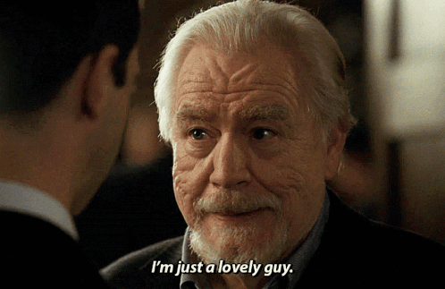 A Man With Gray Hair And A Beard Is Talking To Another Man And Says I 'M Just A Lovely Guy GIF