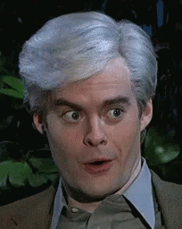 A Man With Gray Hair Is Making A Funny Face . GIF