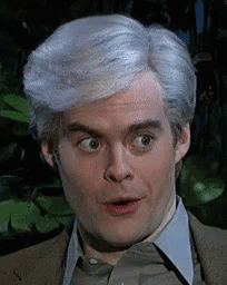 A Man With Gray Hair Is Making A Surprised Face . GIF