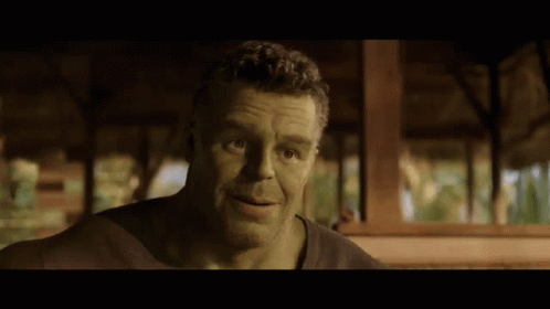 A Man With Green Hair And A Beard Is Looking At The Camera GIF
