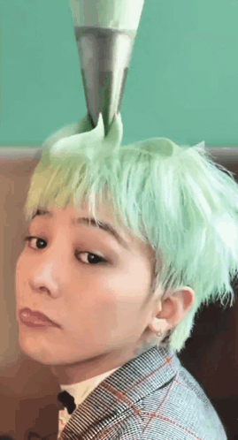 A Man With Green Hair Has A Cone On His Head GIF