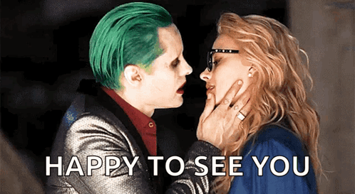 A Man With Green Hair Is Kissing A Woman With The Words Happy To See You Written Below Them GIF