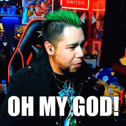 A Man With Green Hair Is Sitting In Front Of A Sign That Says Switch GIF