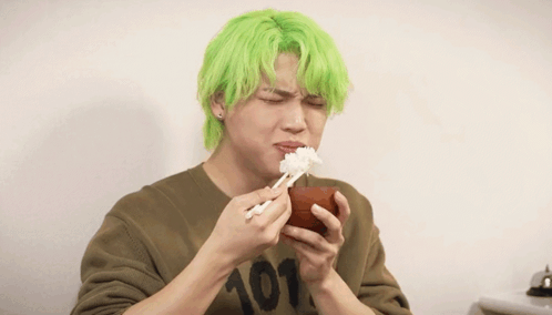 A Man With Green Hair Wearing A Shirt With The Number 101 On It GIF