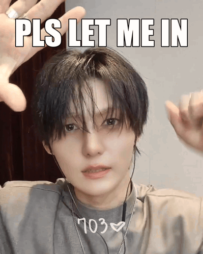 A Man With Headphones And A Shirt That Says ' 703 ' On It GIF