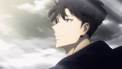 A Man With Headphones On His Ears Looks At The Sky GIF