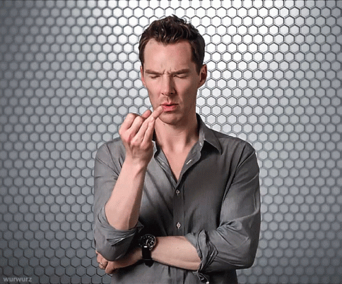 A Man With His Arms Crossed And A Watch On His Wrist GIF