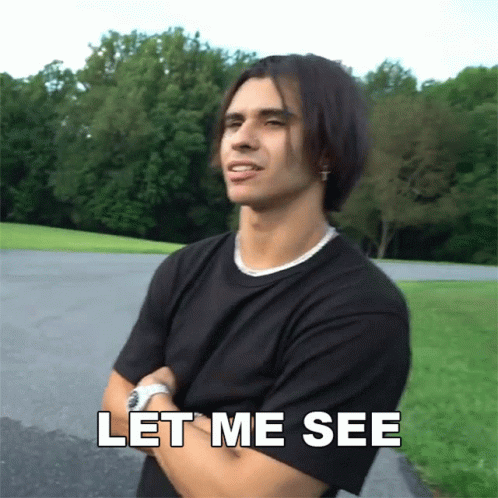 A Man With His Arms Crossed And The Words Let Me See Above Him GIF