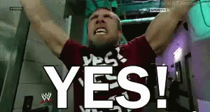 A Man With His Arms In The Air And The Word Yes Behind Him GIF