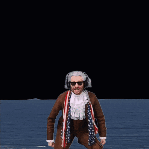 A Man With His Arms In The Air Stands In Front Of A Sign That Says Water GIF