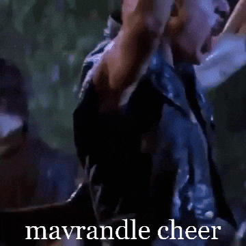 A Man With His Arms In The Air With The Words Mavrandle Cheer Written Below Him GIF