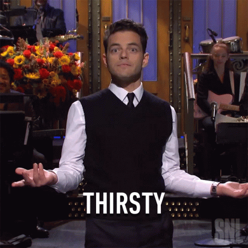 A Man With His Arms Outstretched And The Word Thirsty Behind Him GIF