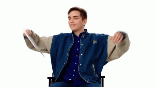 A Man With His Arms Outstretched Is Wearing A Blue And White Jacket With The Word Boston On The Sleeves GIF
