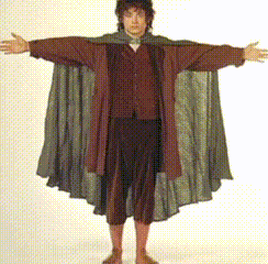 A Man With His Arms Outstretched Is Wearing A Cloak GIF