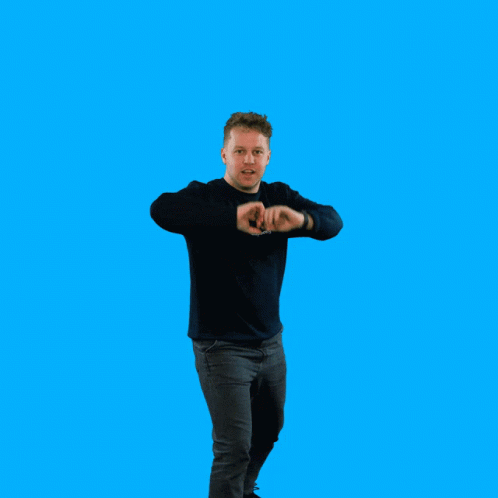 A Man With His Arms Outstretched Wearing A Black Sweatshirt That Says ' Squirrel ' On It GIF