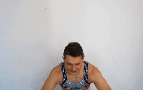 A Man With His Arms Outstretched Wearing A Usa Tank Top GIF