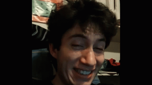 A Man With His Eyes Closed And His Mouth Open GIF