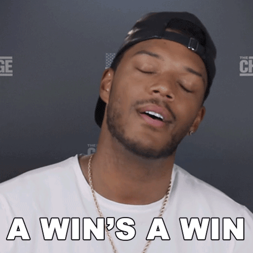 A Man With His Eyes Closed And The Words A Win 'S A Win GIF