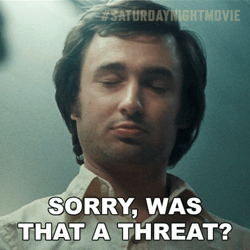 A Man With His Eyes Closed And The Words Sorry Was That A Threat Below Him GIF