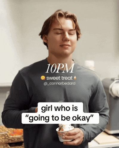 A Man With His Eyes Closed Holding A Cup Of Ice Cream With The Time Of 10Pm GIF