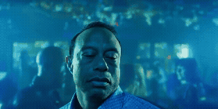 A Man With His Eyes Closed In A Blue Shirt GIF