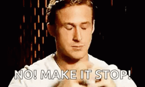 A Man With His Eyes Closed Is Holding A Kitten And Says `` No ! Make It Stop ! '' GIF