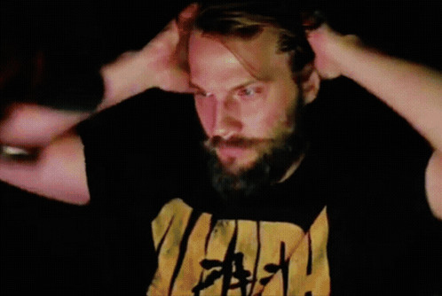 A Man With His Eyes Closed Is Wearing A Black Shirt With The Word Faith On It GIF