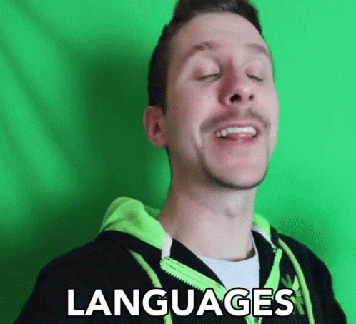 A Man With His Eyes Closed Is Wearing A Green Hoodie That Says Languages On It GIF