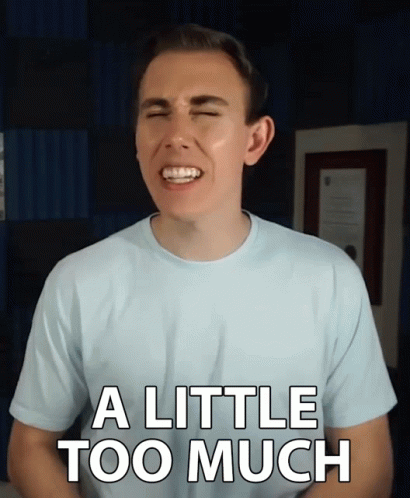 A Man With His Eyes Closed Is Wearing A Shirt That Says " A Little Too Much " GIF
