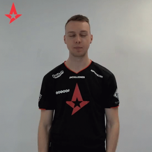A Man With His Eyes Closed Wears A Black Shirt With A Jack & Jones Logo On It GIF