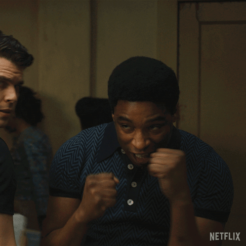 A Man With His Fist In The Air And A Netflix Logo In The Corner GIF