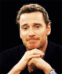 A Man With His Hands Folded Making A Face GIF