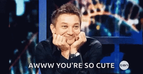 A Man With His Hands On His Face And The Words Awww You 'Re So Cute GIF