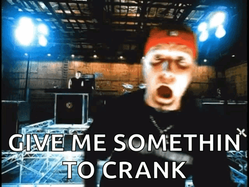 A Man With His Mouth Open And The Words Give Me Somethin To Crank Behind Him GIF