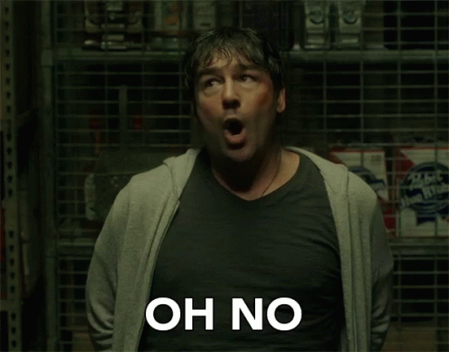 A Man With His Mouth Open Says Oh No In Front Of A Store Shelf GIF