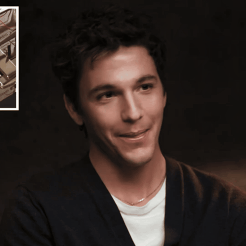 a man with his tongue hanging out is smiling