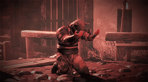 A Man With Horns On His Head Is Kneeling On The Ground GIF