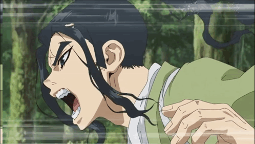 A Man With Long Black Hair And A Green Shirt Is Screaming GIF