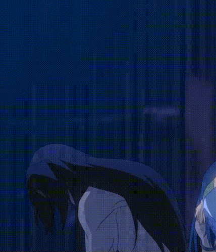 A Man With Long Black Hair Is Standing In A Dark Room With His Arms Outstretched GIF