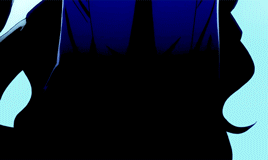A Man With Long Black Hair Is Wearing A Blue Suit And A Tie GIF