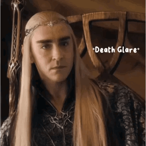 A Man With Long Blonde Hair Is Wearing A Crown And The Words Death Glare GIF