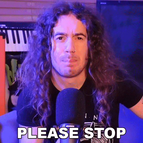 A Man With Long Curly Hair Is Talking Into A Microphone And Saying Please Stop . GIF