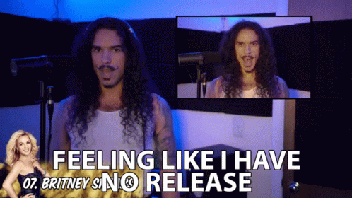 A Man With Long Curly Hair Says " Feeling Like I Have Britney Snc Release " GIF